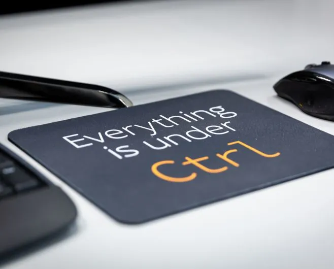 a mouse mat with the text “everything is under control”